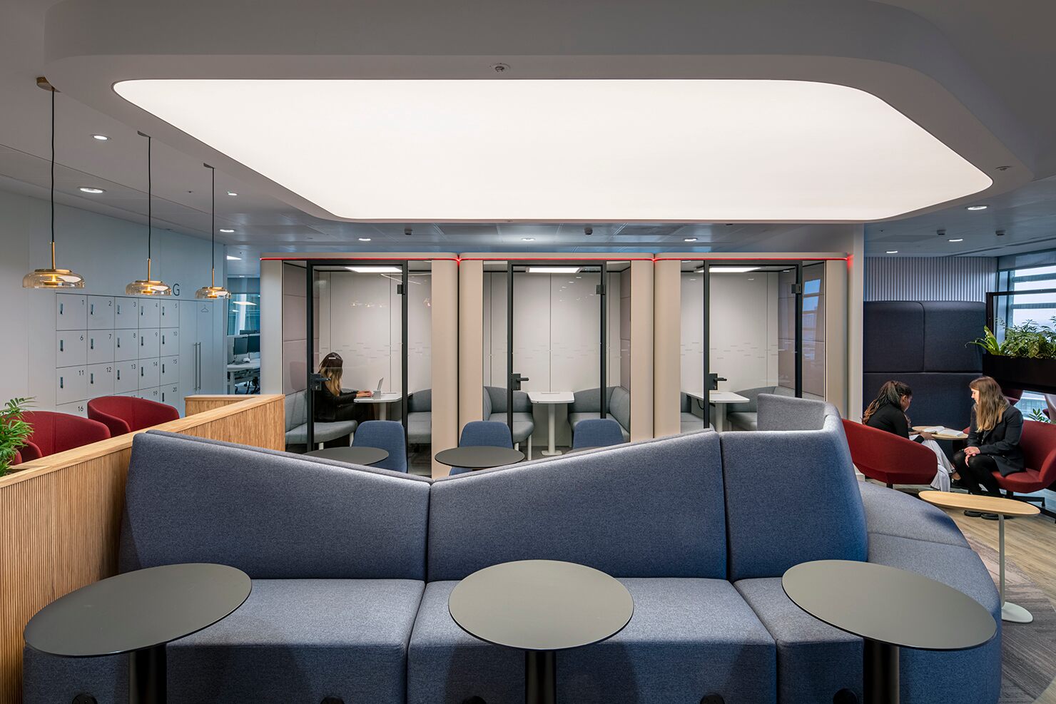 Sedus se:cube enclosed pods support quiet work in the lounge spaces at this insurance company