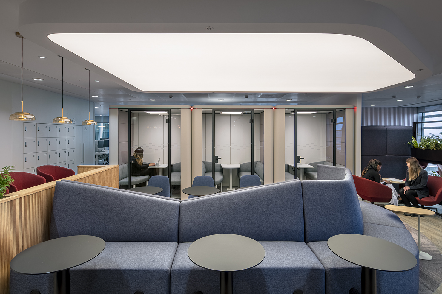 Sedus se:cube enclosed pods support quiet work in the lounge spaces at this insurance company