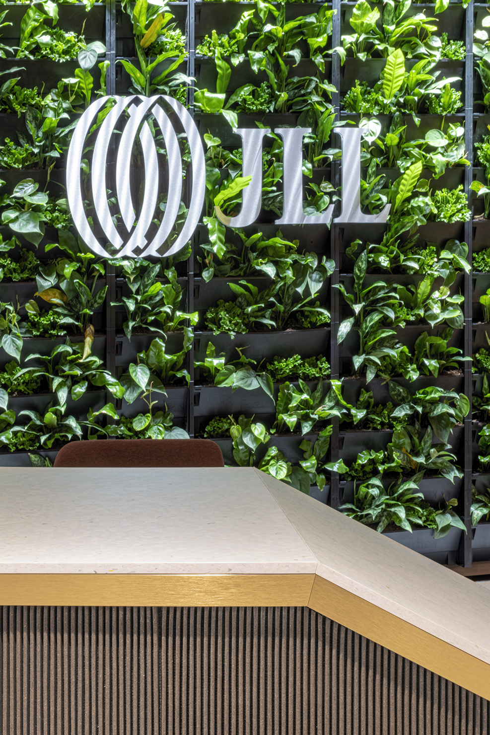 Smile Plastics reception desk countertop at JLL’s 20 Water Street office